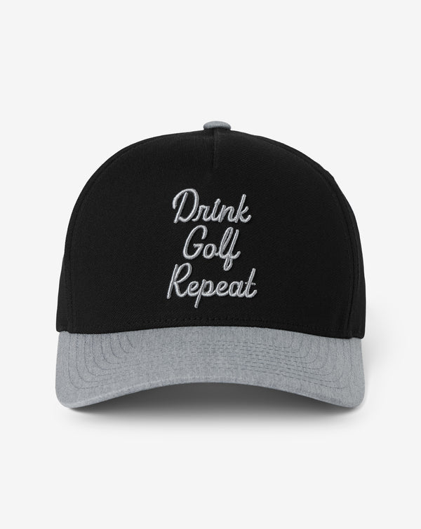 Front view of the TravisMathew Swing & Sip golf hat featuring embroidered Drink Golf Repeat lettering on a black snapback with heather grey brim.