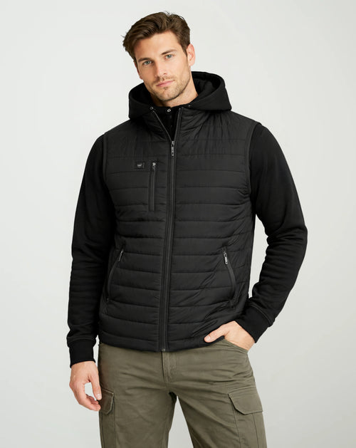 Man wearing the G-Tech Men’s Heated Vest in black over a black hoodie