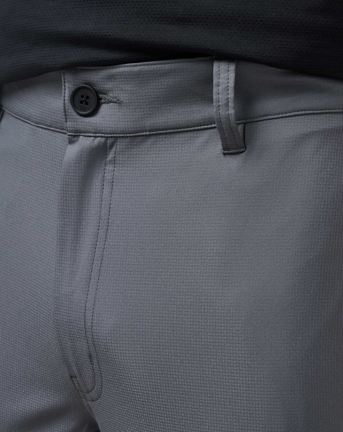 Detail shot of the Open to Close Jogger in grey with stretch waistband and button closure.