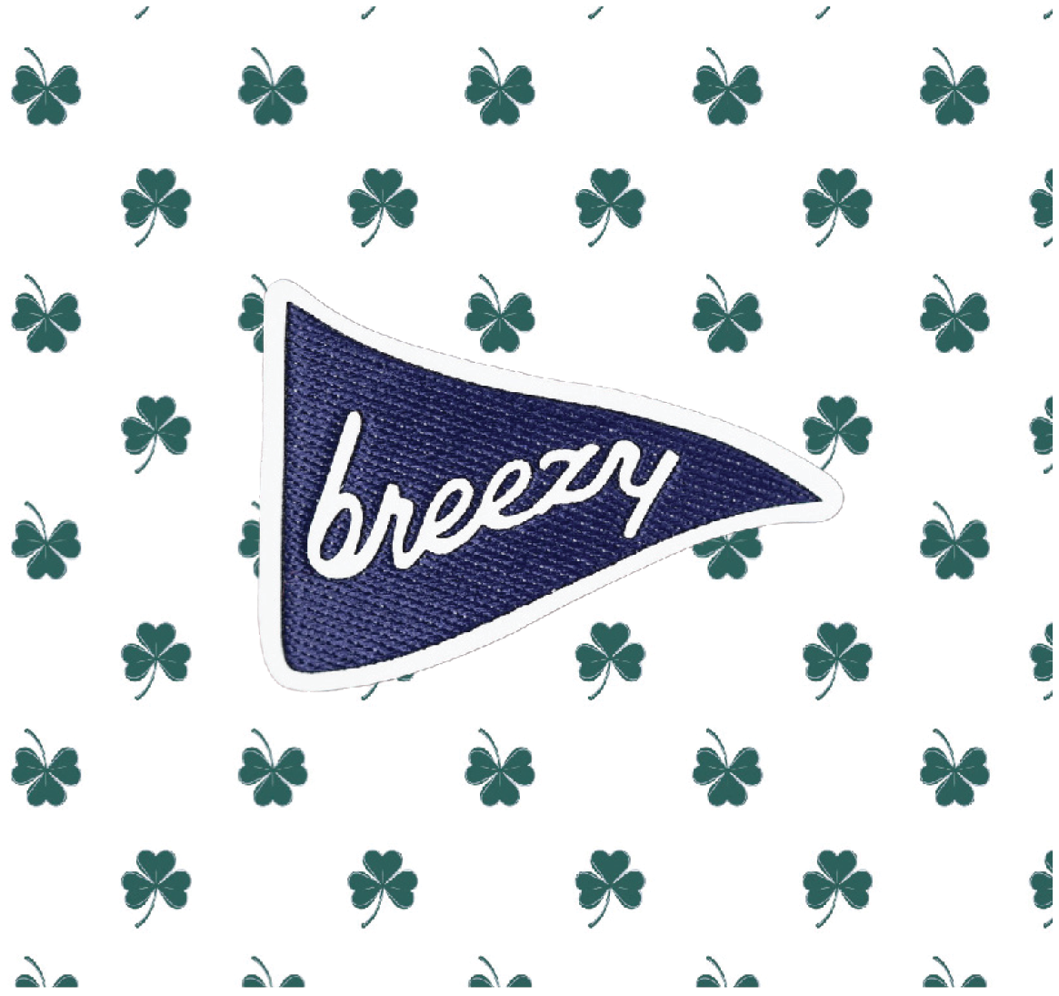 Breezy logo on Clovers Polo green shamrock print detail.