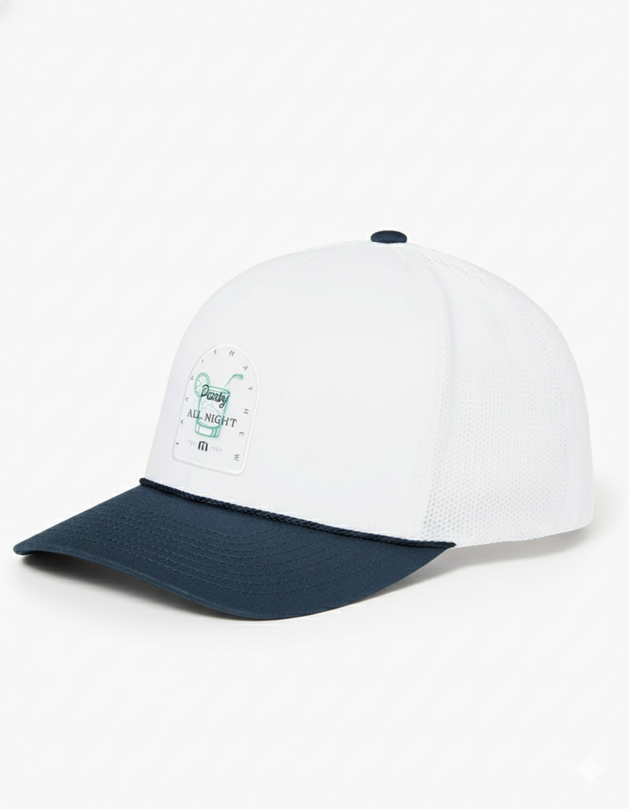Side view of the TravisMathew Beer Break Hat in white with navy brim, featuring a mesh back and front patch that reads ‘Party All Night’ with a cocktail graphic.