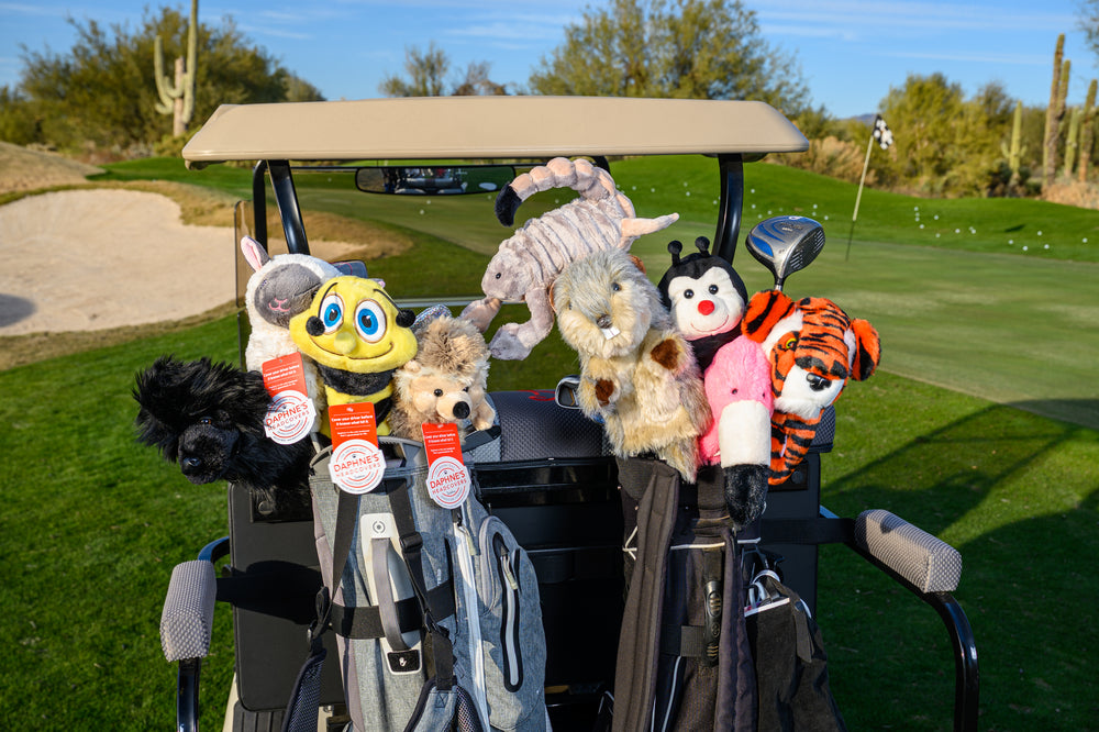 Plush scorpion themed hybrid golf headcover protecting a club.