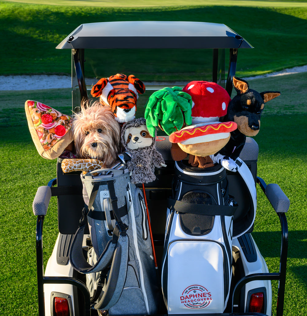 Plush scruffy dog themed golf driver headcover protecting a club.