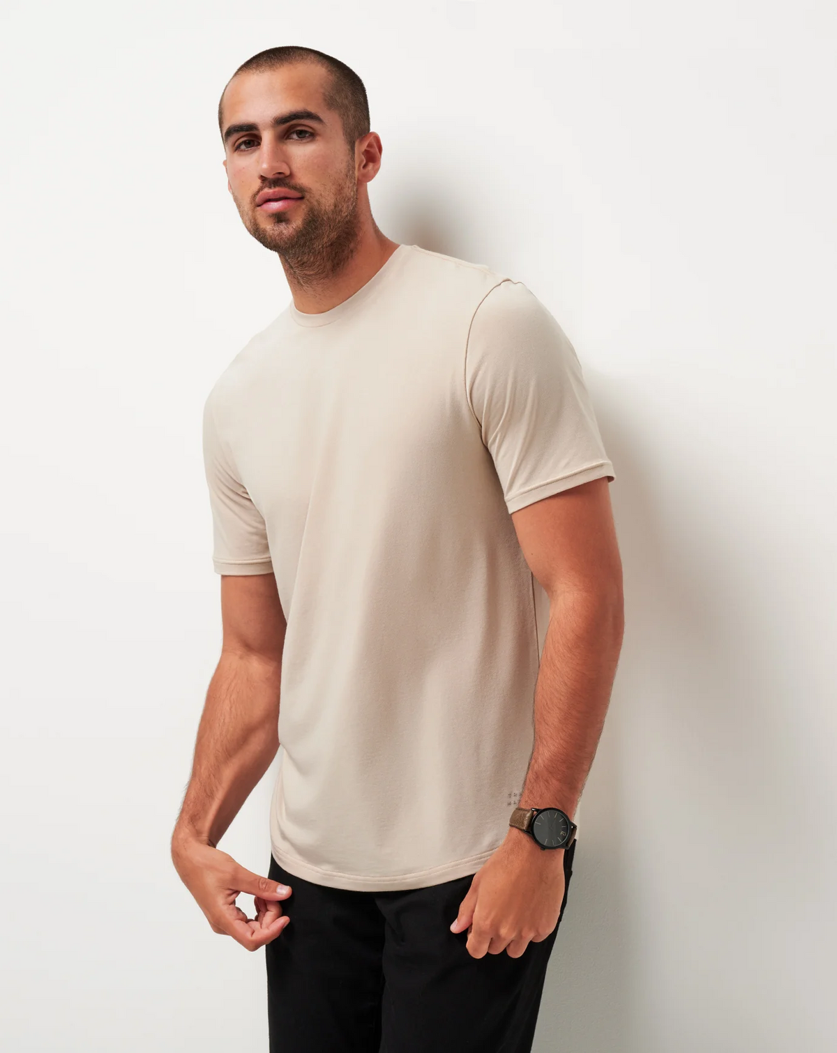 Male model wearing the TravisMathew Cloud Crew Tee in Italian Sand, shown from the front