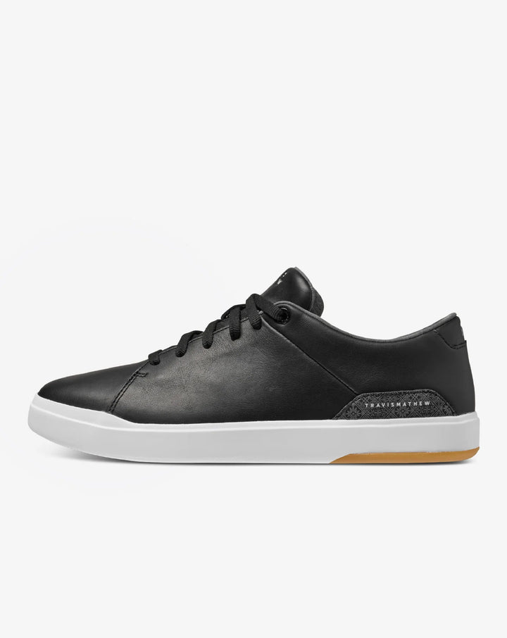 Black leather TravisMathew Modern Cup Shoe with white sole.