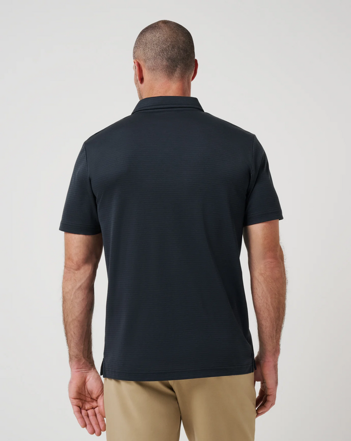 Back view of Zinna 2.0 performance polo in black with clean, streamlined silhouette