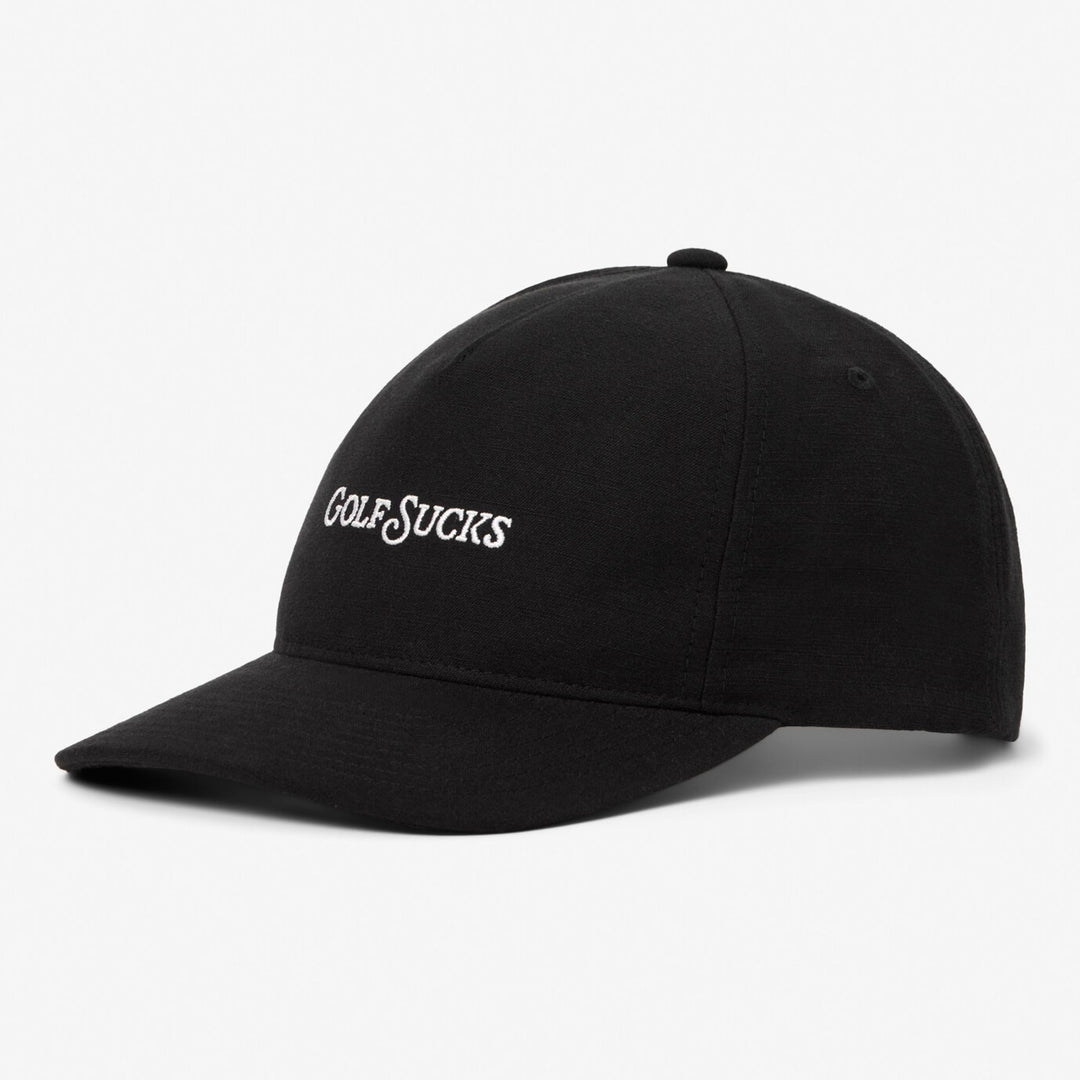 Black TravisMathew cap with 'GOLF SUCES' text on a white background