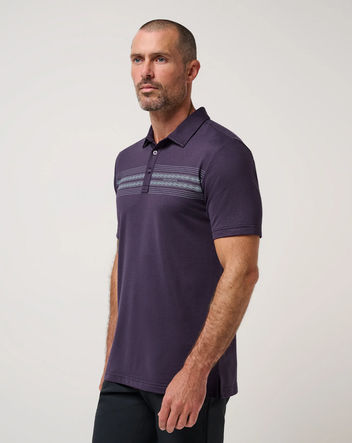 Side angle of men’s TravisMathew featherweight chest stripe polo