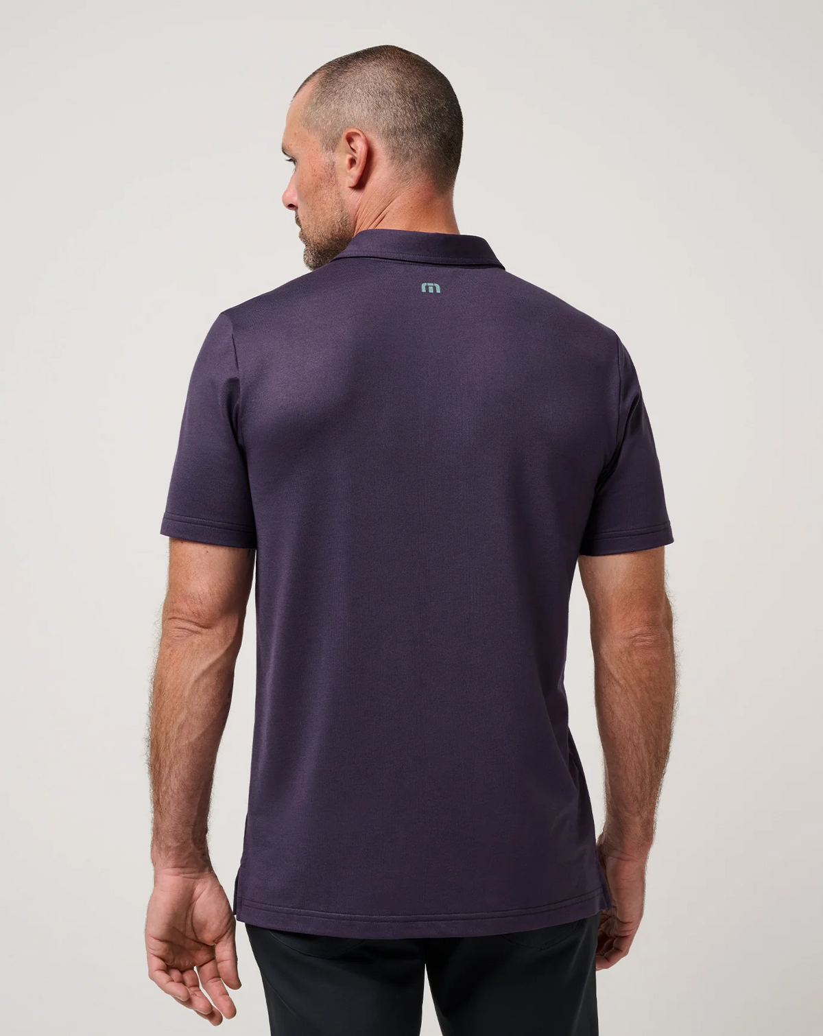 Back view of men’s TravisMathew featherweight chest stripe polo
