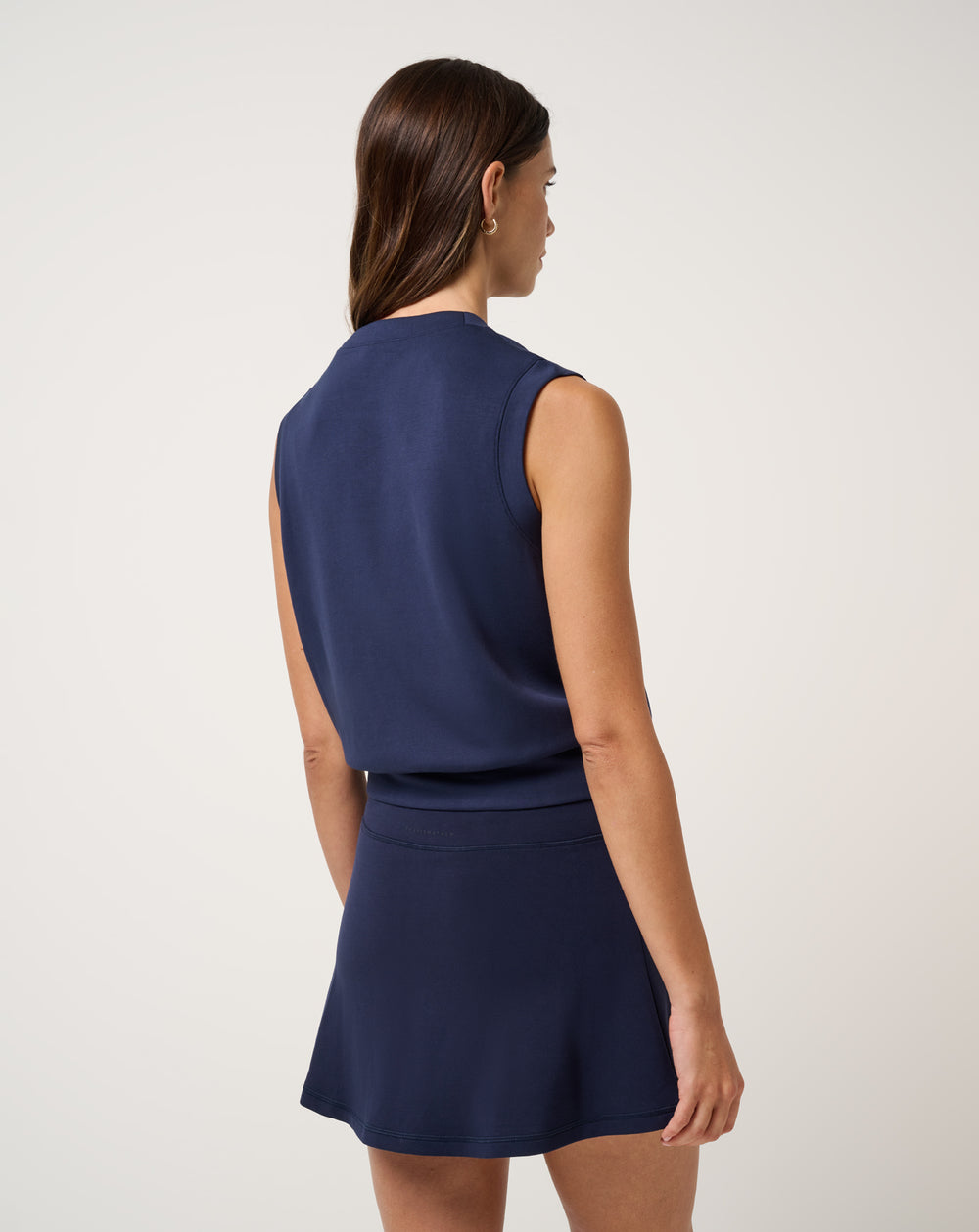 Back view of TravisMathew women’s Skyloft Soft Vest in navy blue.
