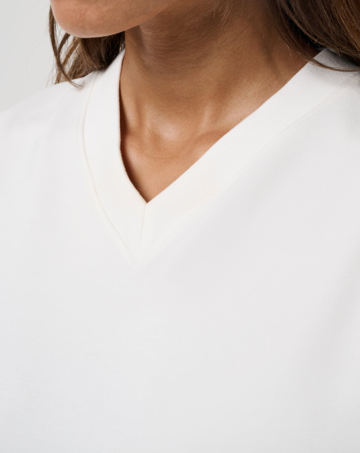 Close-up of TravisMathew women’s Skyloft Soft Vest V-neckline detail.