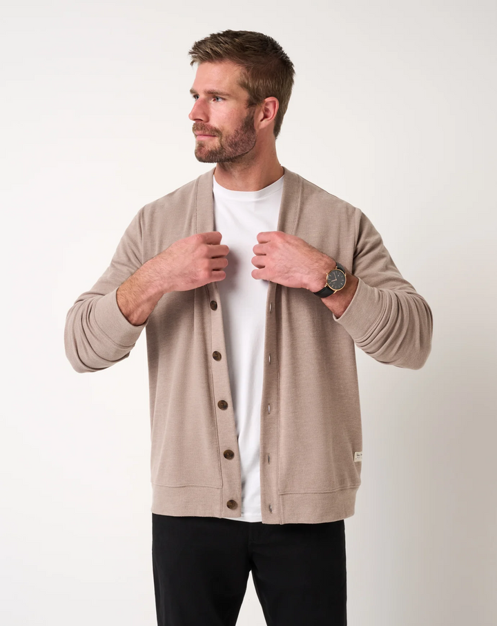 Front view of men’s heather beige cardigan sweater with V-neck opening and button front, worn over a white t-shirt
