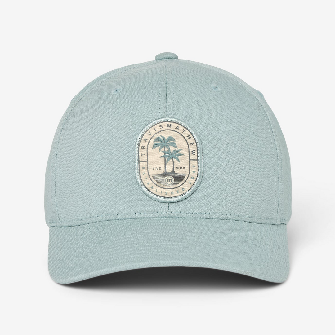 Front view of light blue snapback hat with oval palm tree logo patch and structured fit