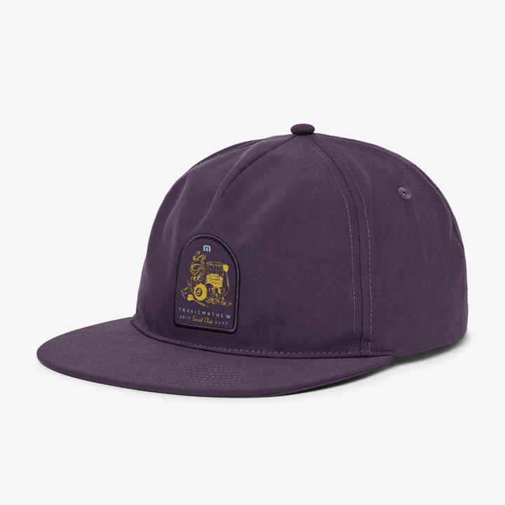 Angled front view of deep purple snapback hat featuring flat bill and embroidered front patch