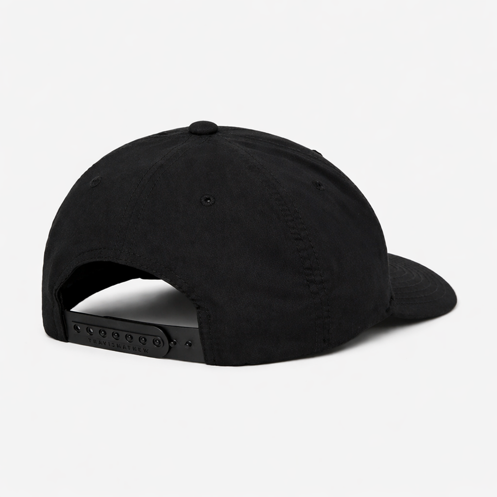 Back view of black TravisMathew Word of Mouth snapback hat with adjustable snap closure