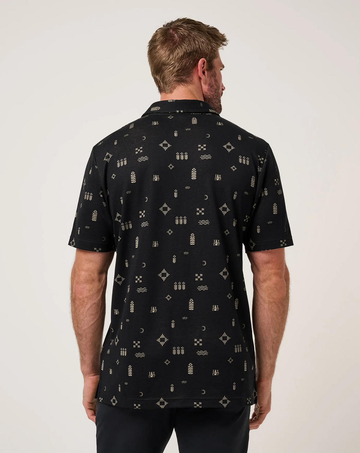 Back view of men’s black Weather Patterns Polo highlighting all-over woven pattern and clean silhouette