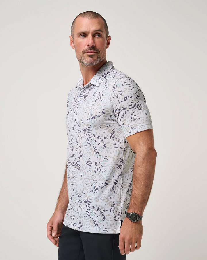 Side view of TravisMathew Featherweight Chill Polo featuring lightweight performance fabric