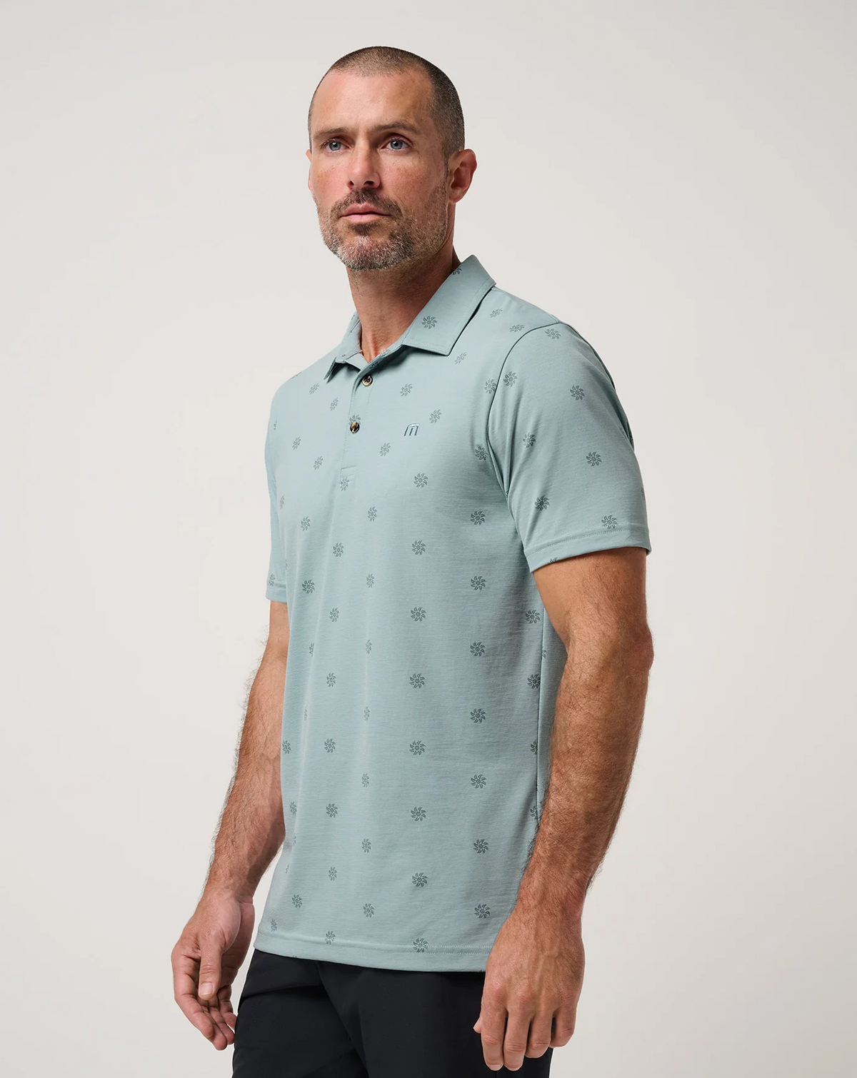 TravisMathew Sol Polo shown from an angled front view