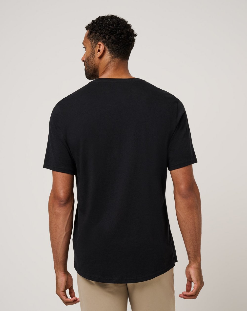 Back view of TravisMathew Social Club Tee in black