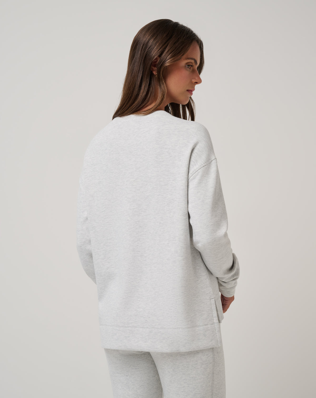 Back of TravisMathew Skyloft Soft Crew Pullover for women in light heather grey, ultra-soft lounge sweatshirt.