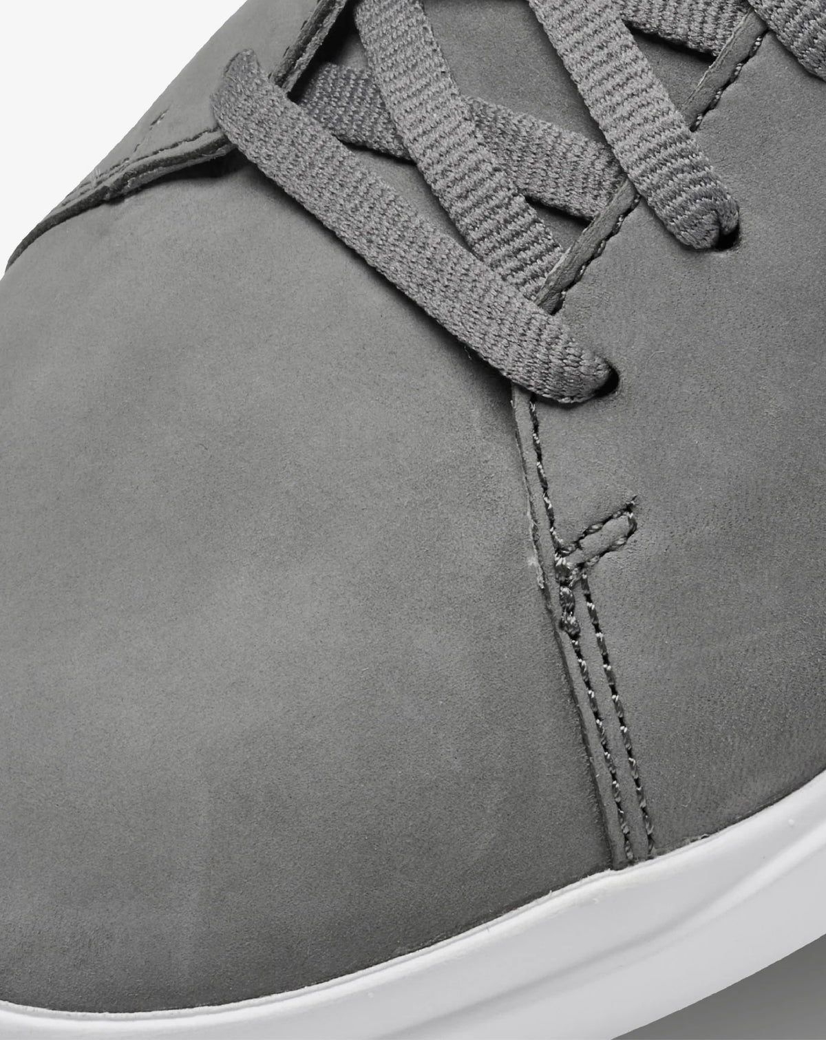 Detail view of the gray TravisMathew Modern Cup Shoe upper and laces.