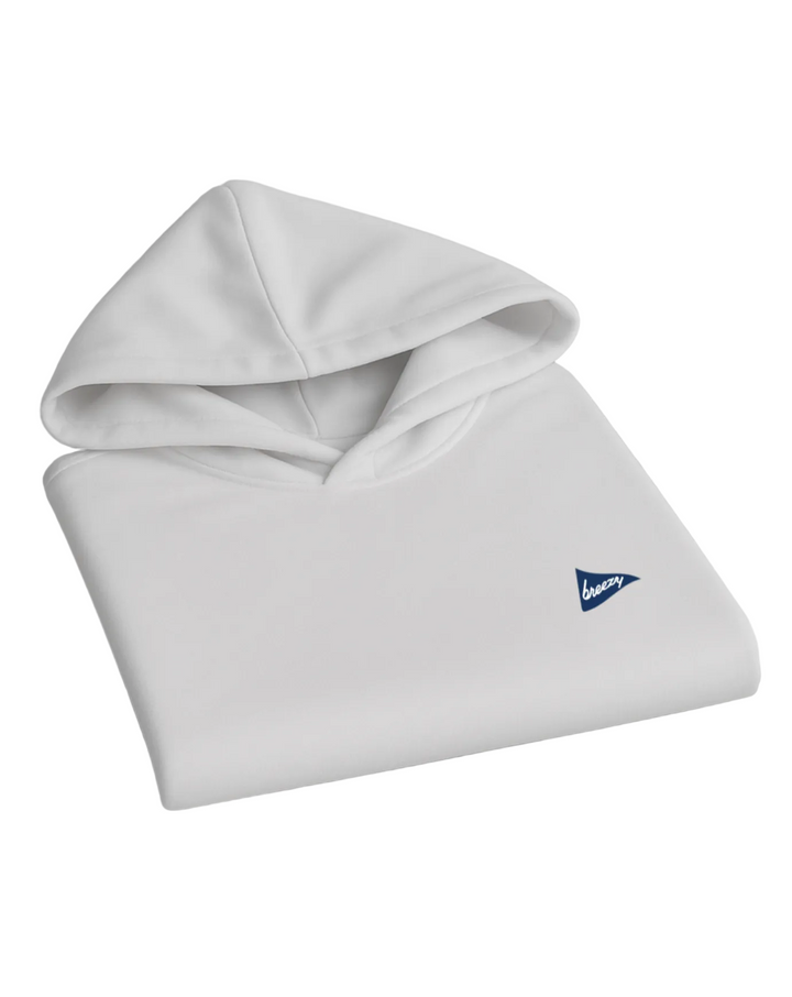 Breezy Golf white performance hoodie with blue logo, folded neatly on light grey background