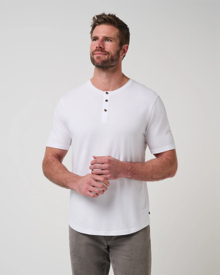 TravisMathew Cloud Henley Tee in white, front view on model showing the three-button henley placket