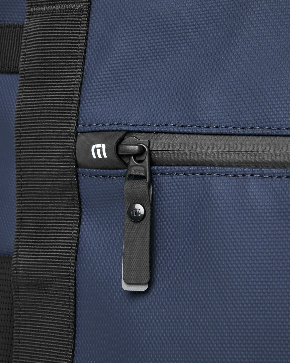 Close-up of the zipper pull detail on the TravisMathew Grab & Go Cooler Bag in Total Eclipse
