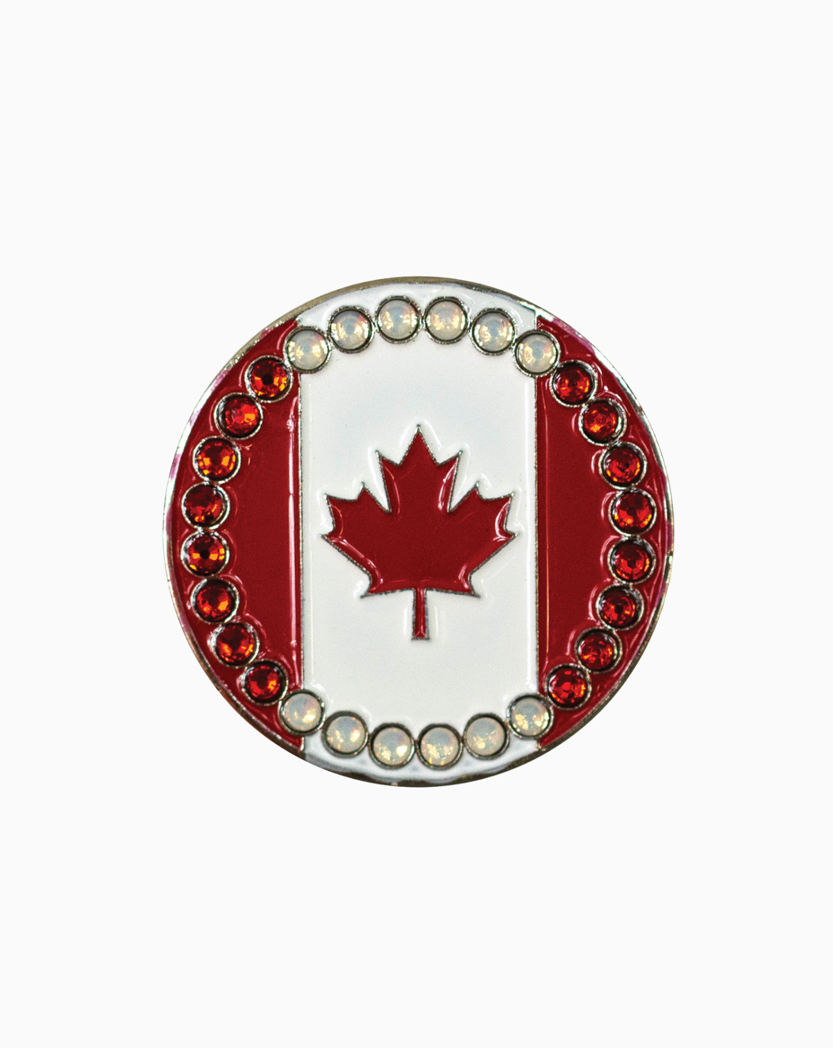 A round golf ball marker featuring a red Canadian maple leaf design, bordered with Swarovski crystals, paired with a silver magnetic hat clip from MXM’s Hat Clip & Ball Marker Set Collection.